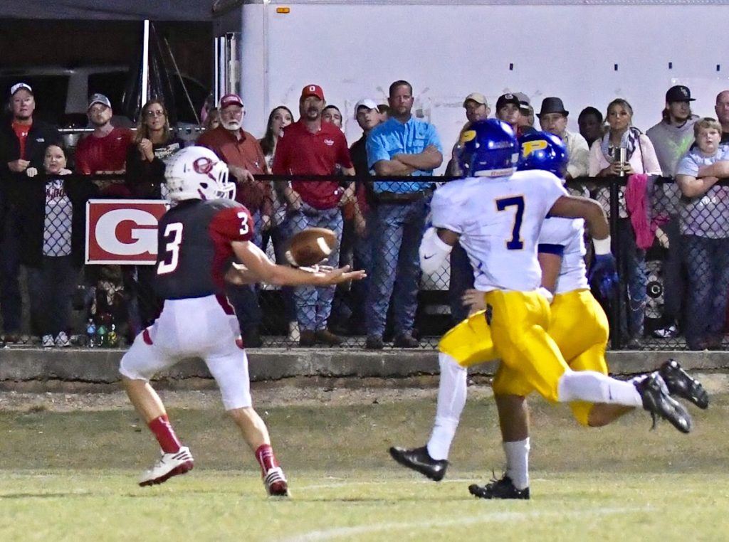 Austin Tucker (3) beats the Piedmont defense and watches the ball into his hands on the touchdown pass that started Ohatchee's second-half comeback. 