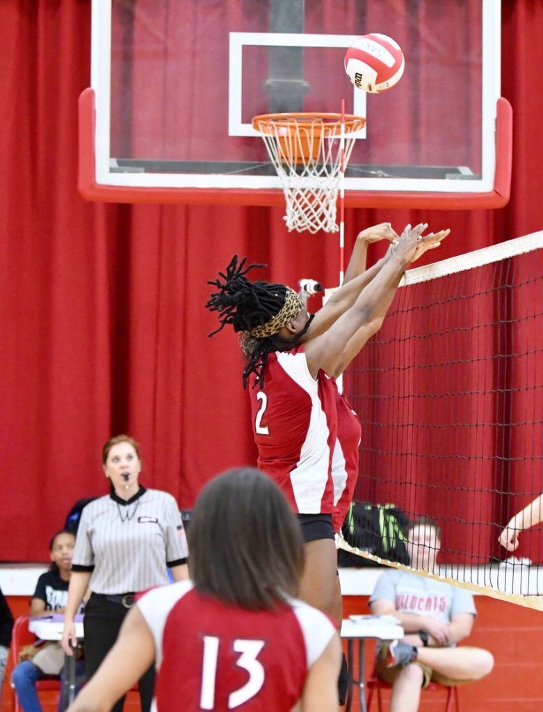 Is the volleyball going to fall into basketball goal or across the net after Anniston's Samaiya Colbert went for the block in the Lady Bulldogs' match with Saks. (Photo by B.J. Franklin/GungHo Photos)