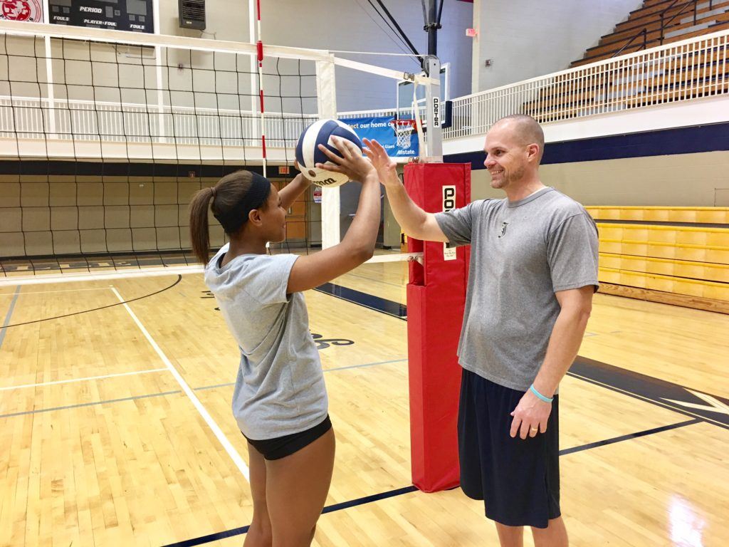 Jacksonville coach David Clark (R) and senior Tatiyana Thomas discuss the finer points of setter play after a recent practice.