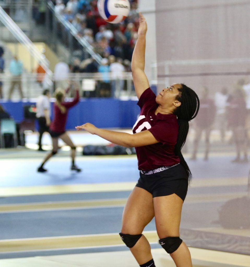 Sacred Heart's Jayla Woods serves to Isabella. Woods had 28 assists and two aces in the match.