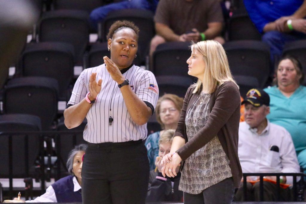 Alexandria coach Whitney Welch listens to an official's explanation of a disputed point early in the second set of the Lady Cubs' 5A title match with St. Paul's. The point later was awarded to the Saints. (All photos by Kristen Stringer/Krisp Pics Photography)