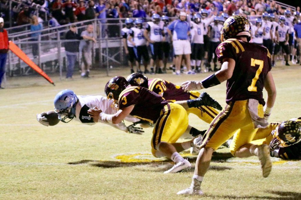 Dakota Jones lunges over the goal line for a Pleasant Valley touchdown.