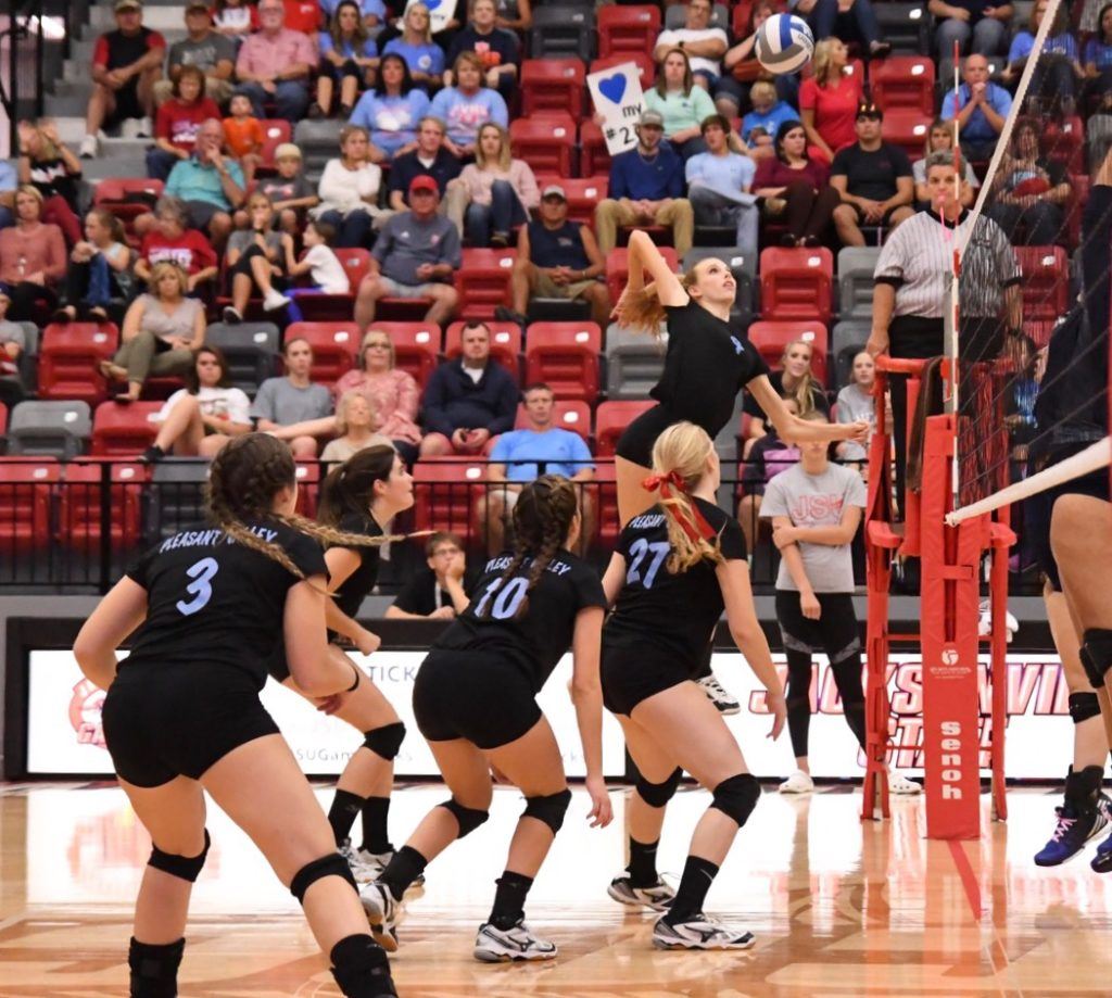 Pleasant Valley's Cammy Cochran, the tournament's outstanding offensive player, gets way up to hit one of her 20 kills in the championship match.