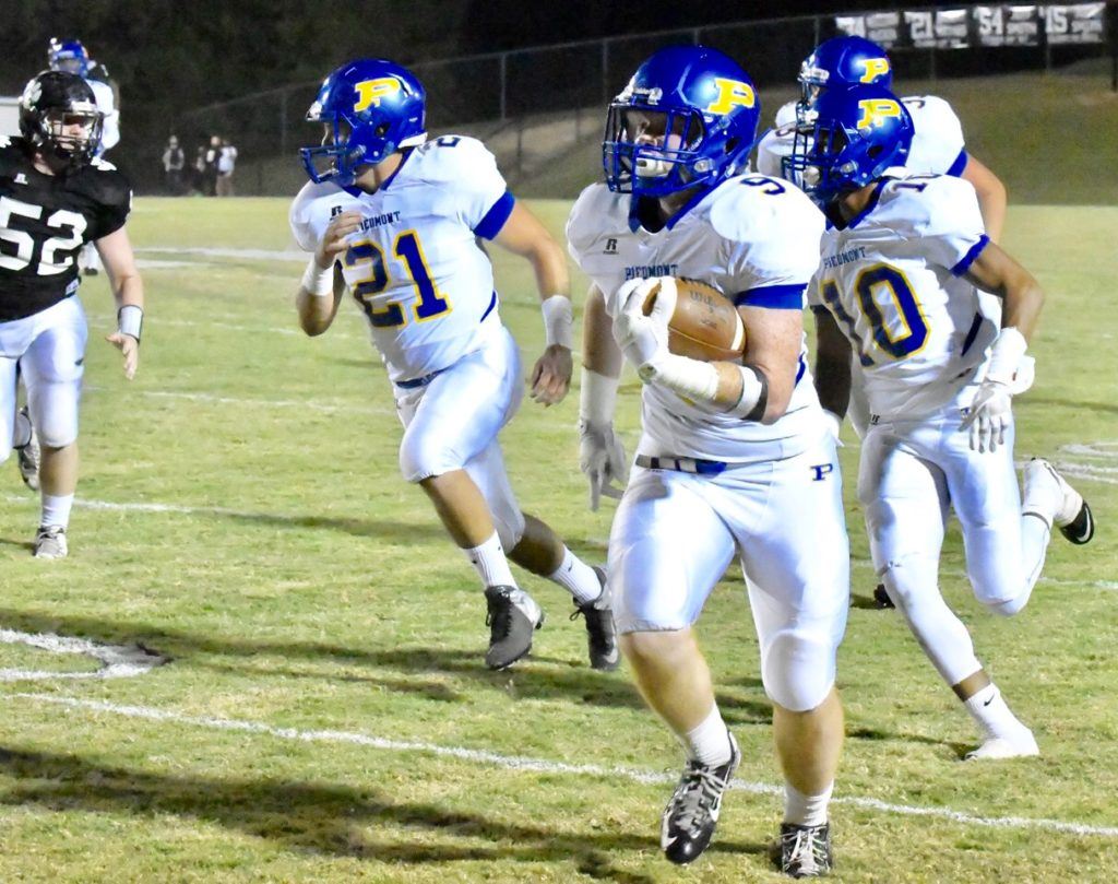 Piedmont's Chase Bobbitt sprints down the sideline with his first-quarter interception return for touchdown Friday night. On the cover, quarterback Taylor Hayes gets through a hole. (Photos by B.J. Franklin/GungHo Photos)