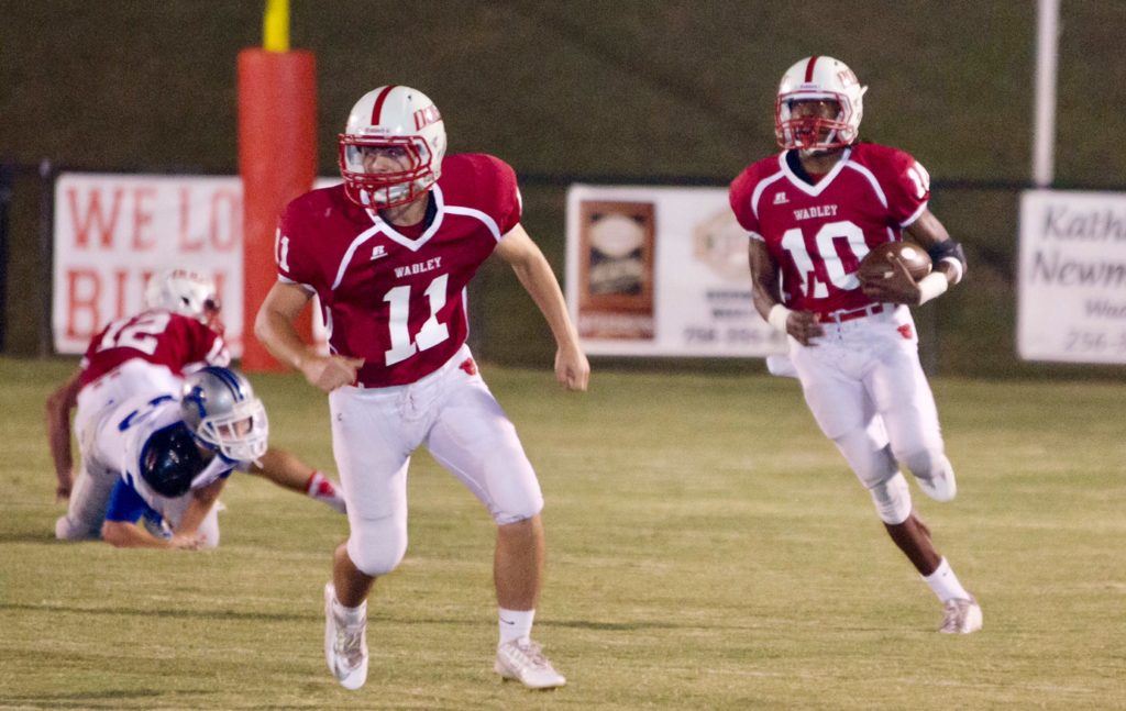 Wadley's Quae Drake returns a punt against Victory Christian behind the blocking of Dalton Brown. On the cover, Wesley Caldwell gets a lot of protection on his punt return. Both Drake and Caldwell scored on punt returns in the game. (Photos by Christy Fordham)