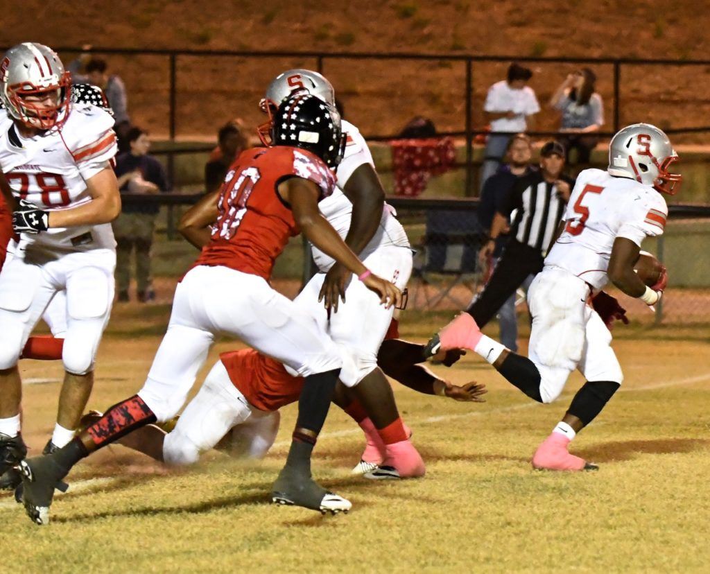 Weaver's Chris Lemon (10) is in hot pursuit of Saks' Rodney Reddick (5). Lemon later blocked a punt that Paul Hubbard scooped up for a touchdown to give the Bearcats the lead. (All photos by B.J. Franklin/GungHo Photos)