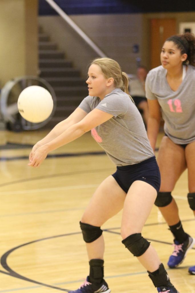 Jacksonville's Caitlyn Ryan keeps the ball alive in the Lady Golden Eagles' match with White Plains Tuesday night. (Photo by Kristen Stringer/Krisp Pics Photography)