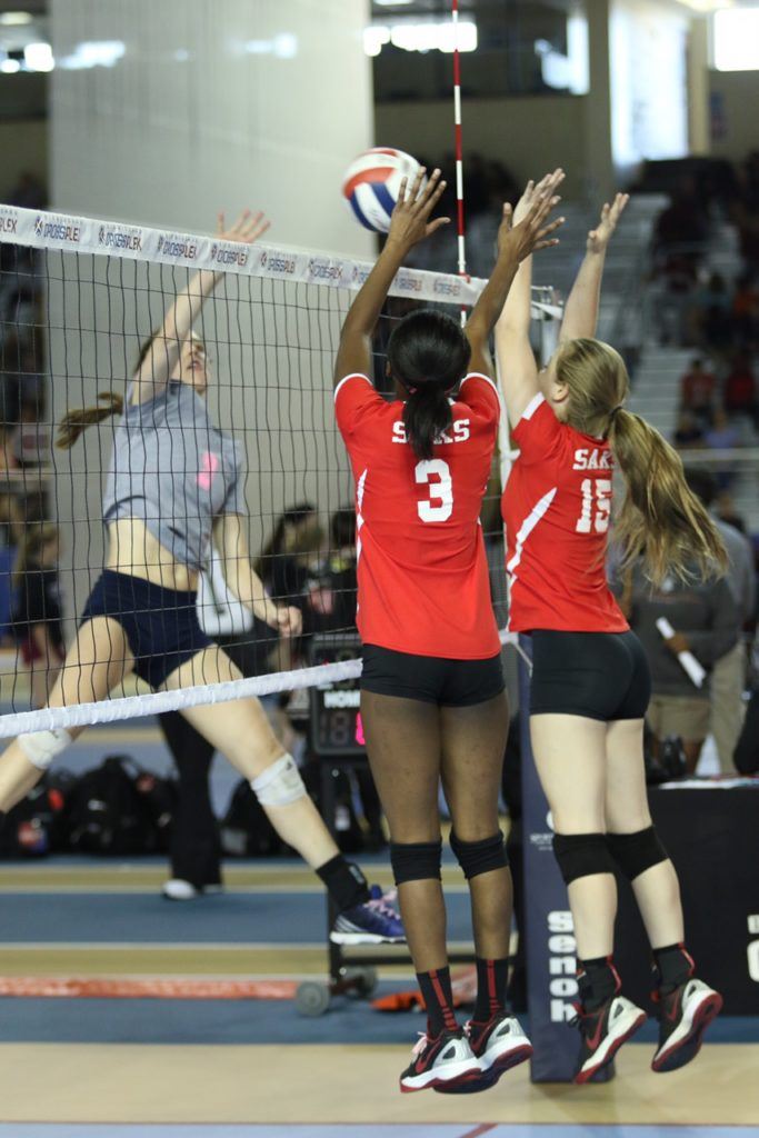 Saks' LaMonica Noel (3) and Madison Tate go up together to block Jacksonville's Elizabeth Poe.