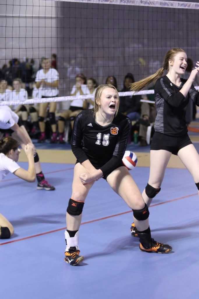 Alexandria's Taylor Spradley shows her excitement after the winning point dropped in the Lady Cubs' 5A semifinal victory over St. John Paul II. On the cover, all the Lady Cubs celebrate. (All photos by Kristen Stringer/Krisp Pics Photography)