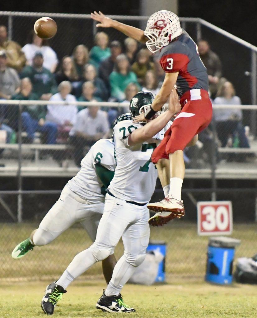 Ohatchee's Austin Tucker (3) tries to go over Locust Fork lineman Preston Castleberry (70) to bat down a pass thrown by Michael Clevenger. (Photo by B.J. Franklin/GungHo Photos)