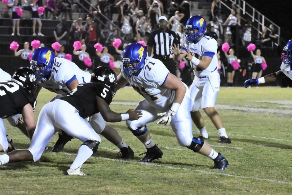 The protection Piedmont quarterback Taylor Hayes (11) has been getting from linemen like Blake Headrick (72) and Mason Langley (71) has been a big part of the Bulldogs' success on offense. (Photo by B.J. Franklin/GungHo Photos)