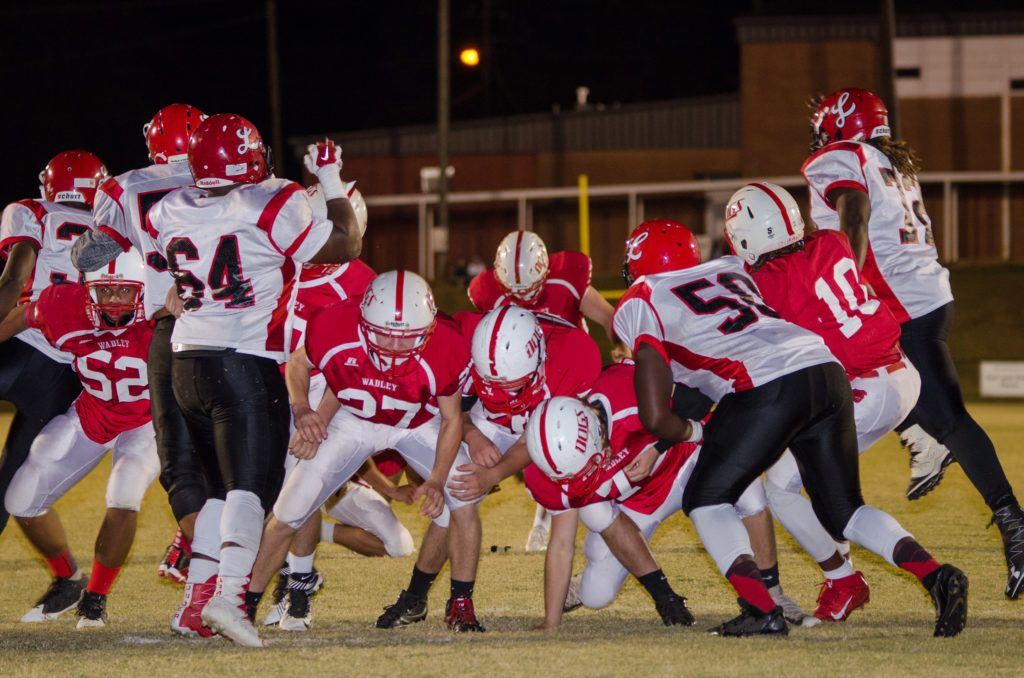 Wadley's line (from left) Chris Hodges, Wesley Caldwell, Clay Cotney, John Freeman and Quae Drake block for Elijah Beverly's kick in last week's opening-round win over Loachapoka. (Photo by Christy Fordham)