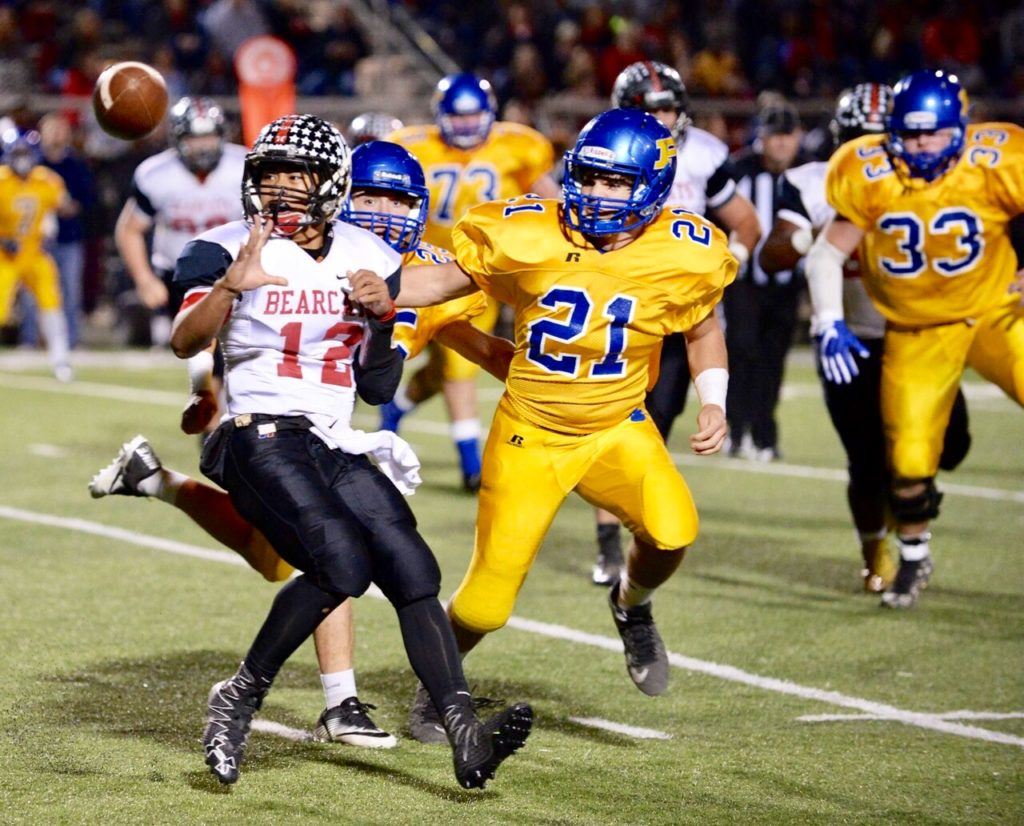 Weaver's Dalton Hamby (12), Piedmont's Logan Smith and the ball converge on the same spot Friday. (Photo by B.J. Franklin/GungHo Photos)