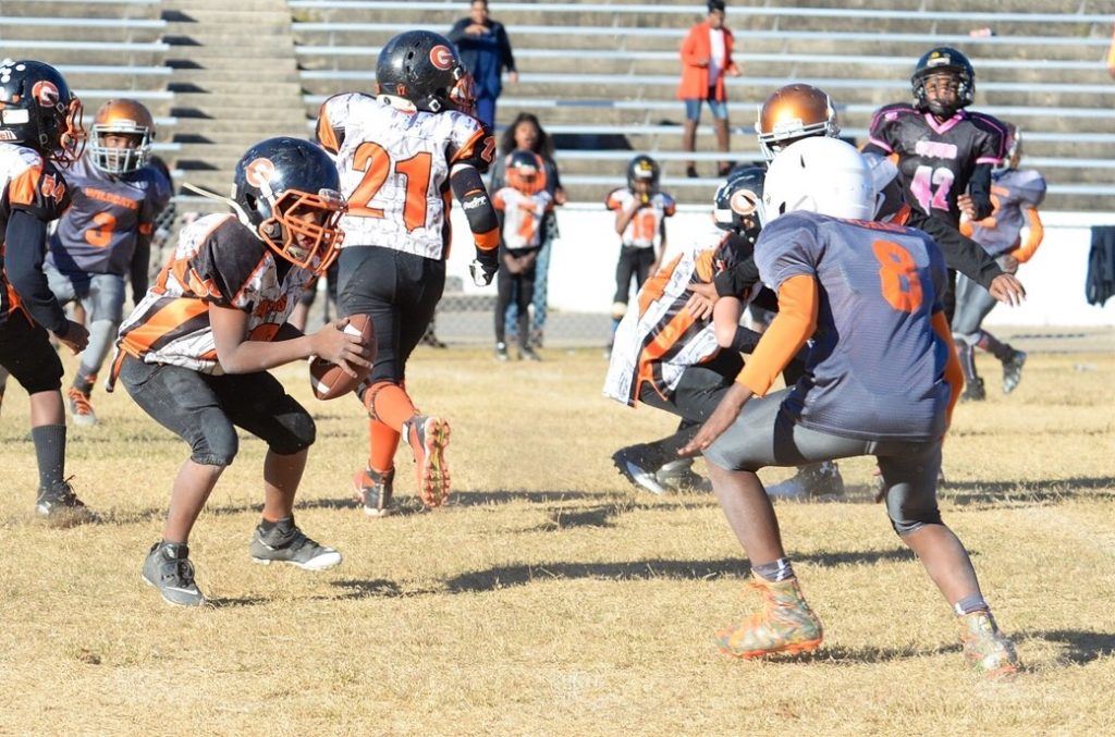 Gators' Dylan Robertson (L) stares down a Fultondale defender as he contemplates the move he's about to make in Saturday's CYFL 10U title game. (All photos by B.J. Franklin/GungHo Photos)