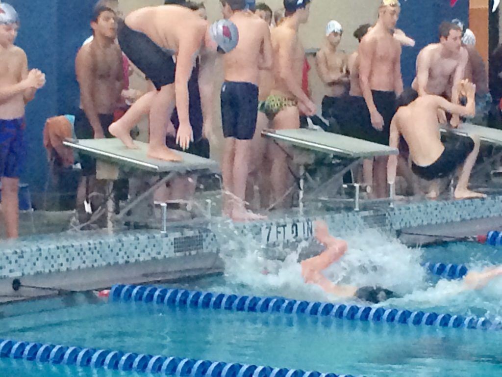 Marshall Twigg (top) waits for Pitts Angell to touch before springing into his anchor leg of the 1A-5A 200 freestyle relay in the AHSAA Central Sectional Meet. On the cover, the qualifying relay team of (left to right) Angell, Slade Haney, Twigg and Camden Kitchen. (Photos courtesy of Johnnie Pearson)