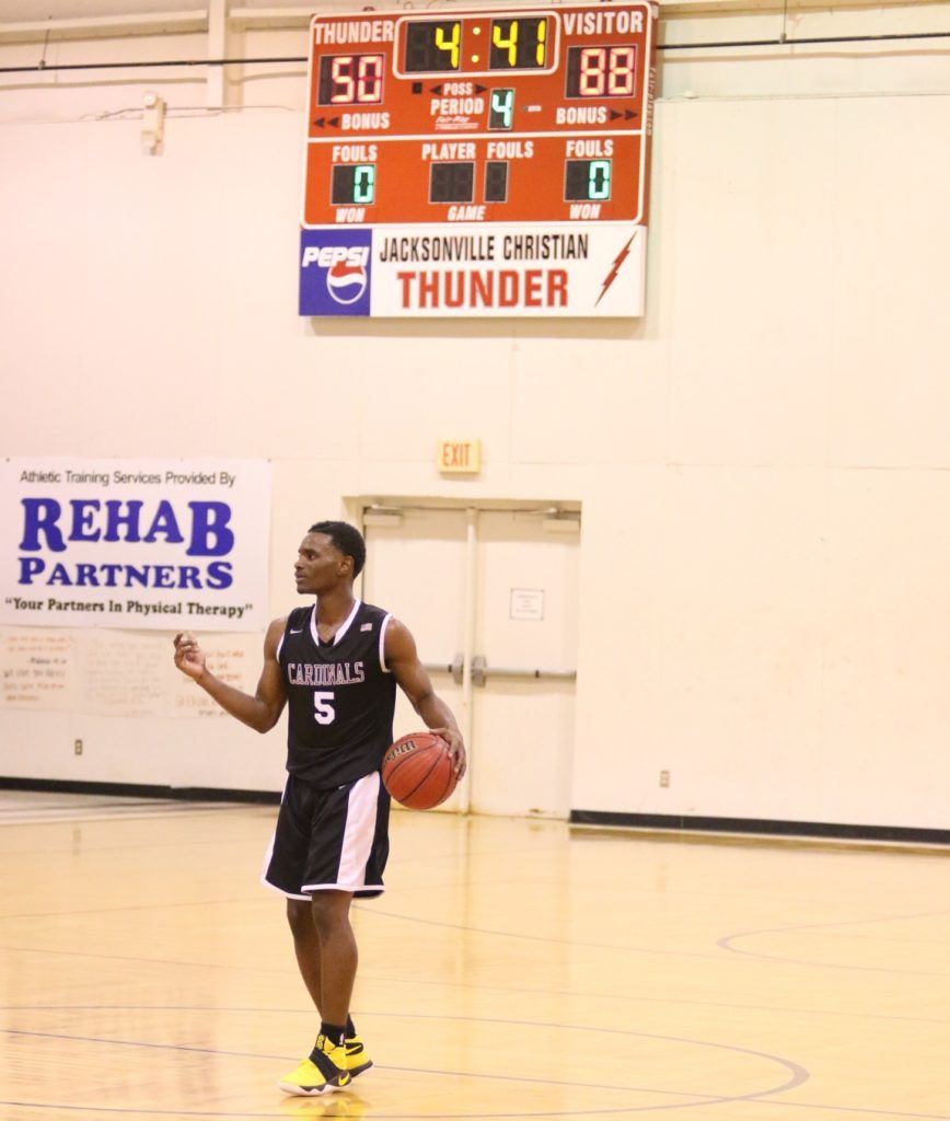 Sacred Heart guard D.J. Heath brings the ball up the floor as the Cardinals have another area game well in hand. Heath finished this possession with a basket as part of a 41-point night. (All photos by Kristen Stringer/Krisp Pics Photography)