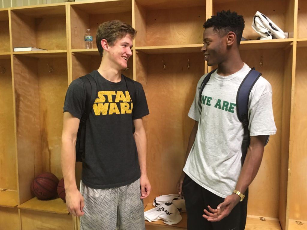 Faith Christian seniors Jack Sills (L) and Jordan Griswould share a moment in the dressing room after combining for 40 points and 30 rebounds in the Lions' season-opening victory over Jefferson Christian.