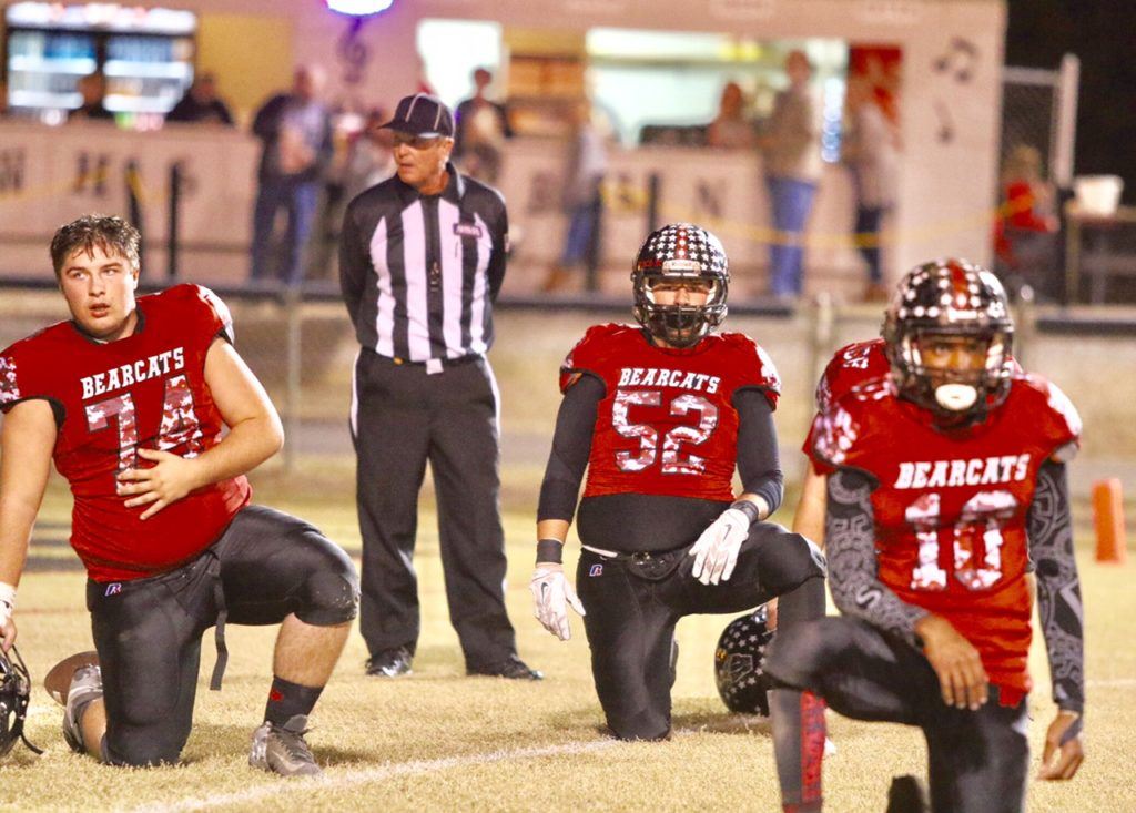 Weaver's Jasper Duke (74), Tyler Perez (52) and Chris Lemon helped the Bearcats post their first playoff shutout in history Friday. 