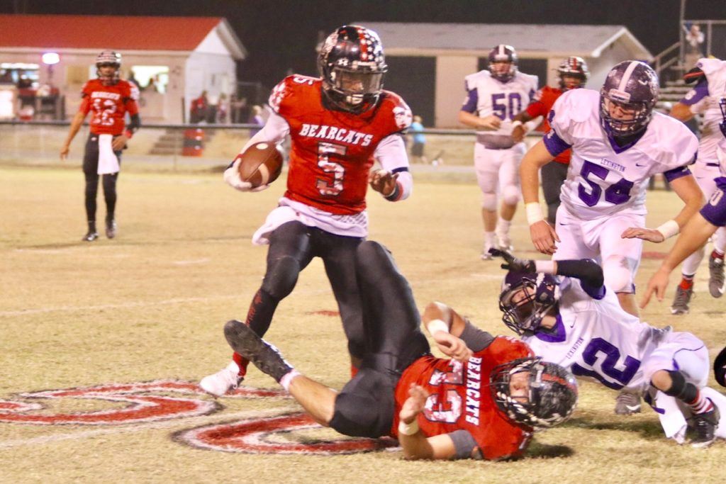 Weaver's Paul Hubbard tries to work his way around traffic to find some running room.