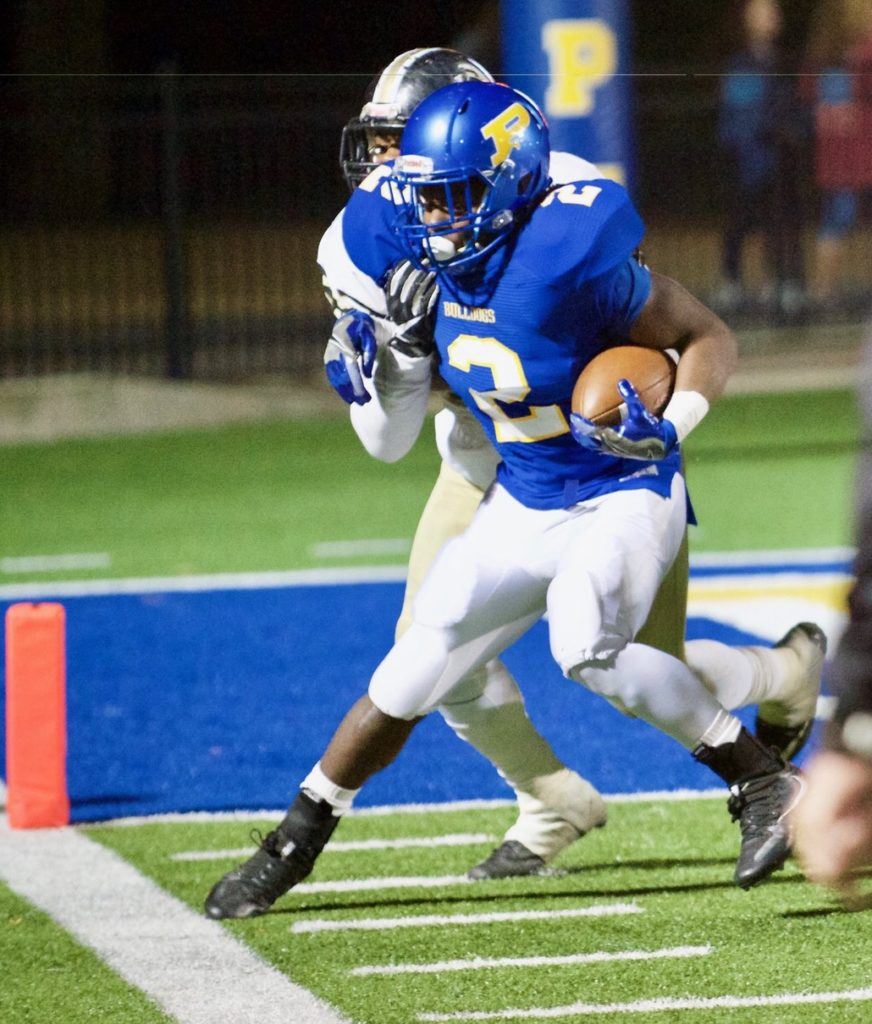 Piedmont's Lee Stanley manages to stay in bounds as he gets closer to the end zone.  Stanley scored two touchdowns in the game. 