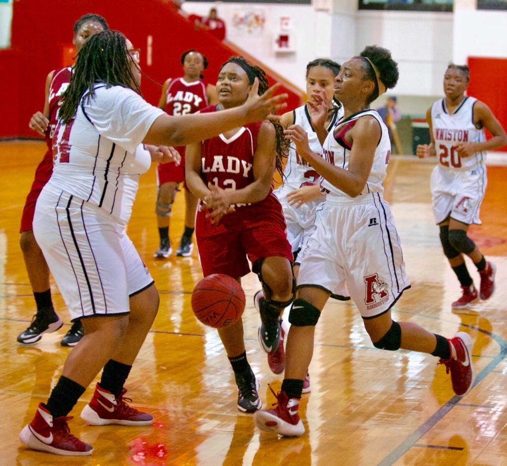 Anniston's Toniah Foster (L) and Miajah Bullock trap Sylacauga's Kayla Dark into a turnover in the second half Tuesday night. (Photo by B.J. Franklin/GungHo Photos)