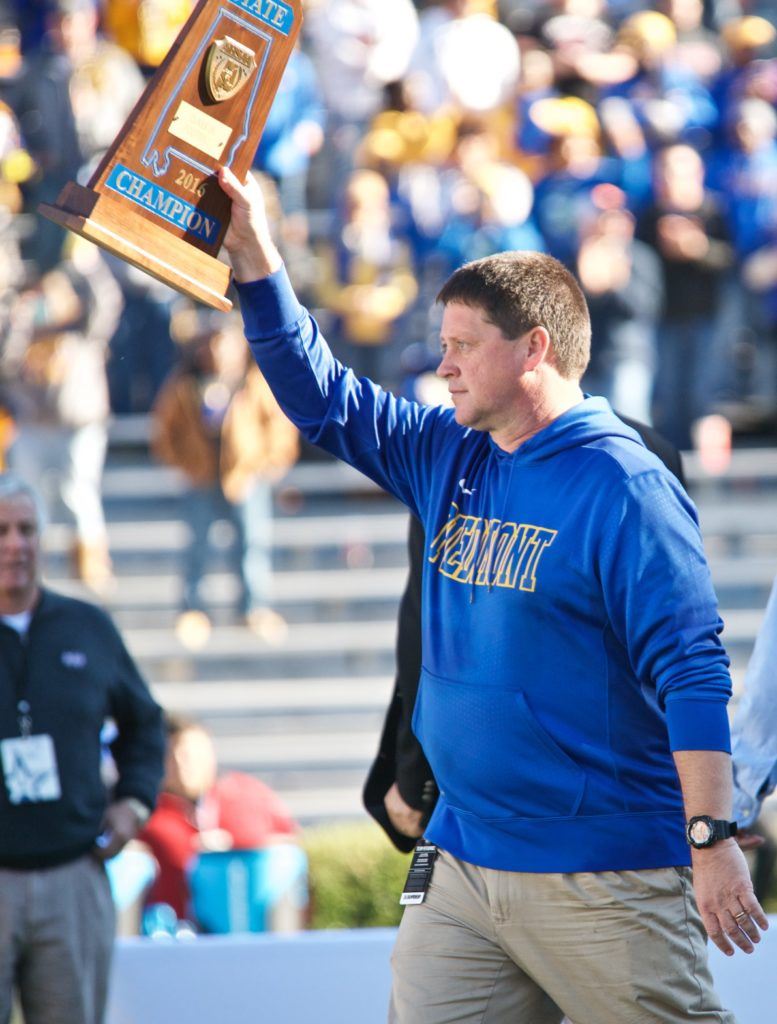 Piedmont coach Steve Smith walks back to his players with the blue championship trophy that will go nicely with the one he brought to them in 2015. (All photos by B.J. Franklin/GungHo Photos)