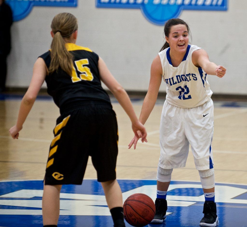 White Plains' Shelby Wood (22) moves the pieces against Cherokee County's Kendal Perry. Both players were their respective teams' high scorers in the overtime game. (Photo by B.J. Franklin/GungHo Photos)