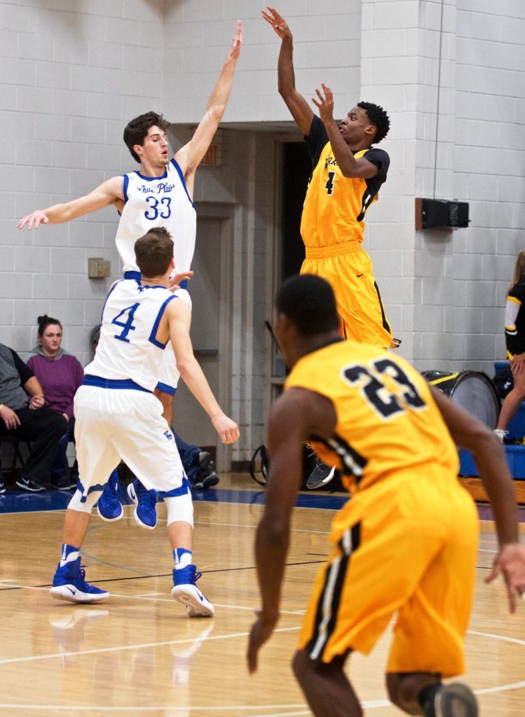 Chris Roden pops a jumper against White Plains' Brett Beaver (33). (Photo by B.J. Franklin/GungHo Photos)