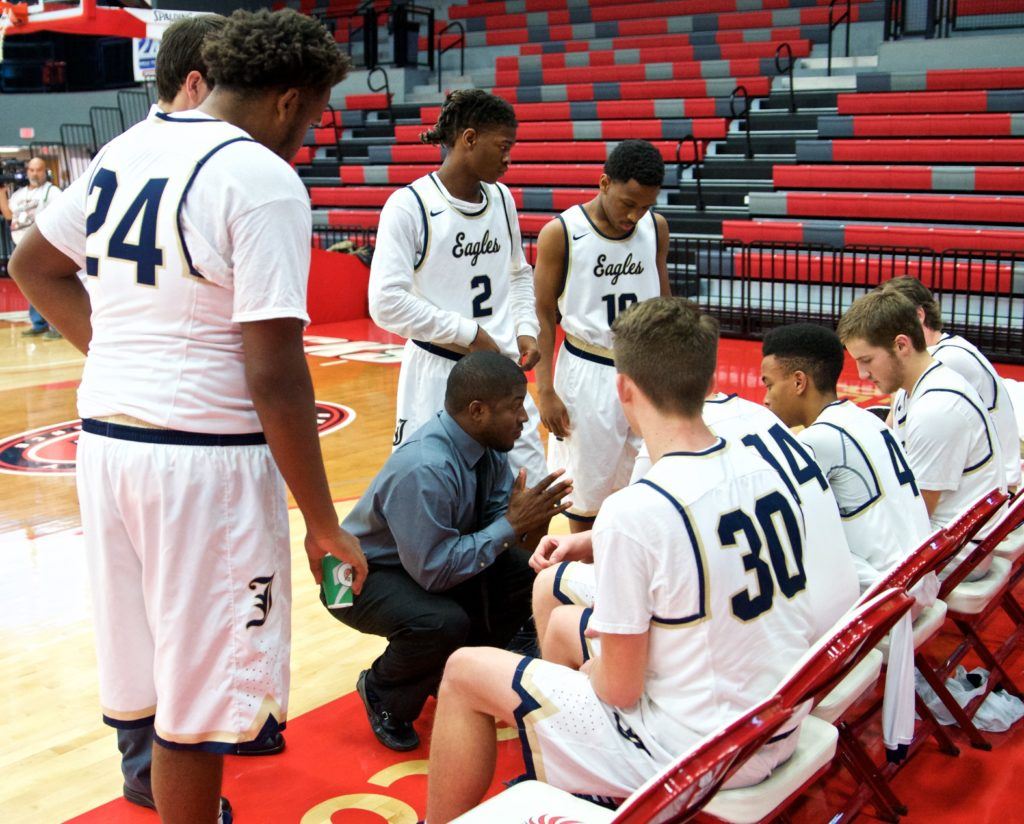 Jacksonville coach Cordell Hunt has an intimate conversation with the eight players he had available against Geraldine Saturday. (Photo by B.J. Franklin/GungHo Photos)