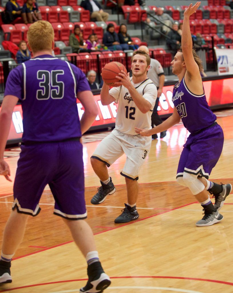 Jacksonville's Josh Glass (12) drives past one Geraldine defender and now has to contend with Laramie McCurdy (35). (Photo by B.J. Franklin/GungHo Photos)