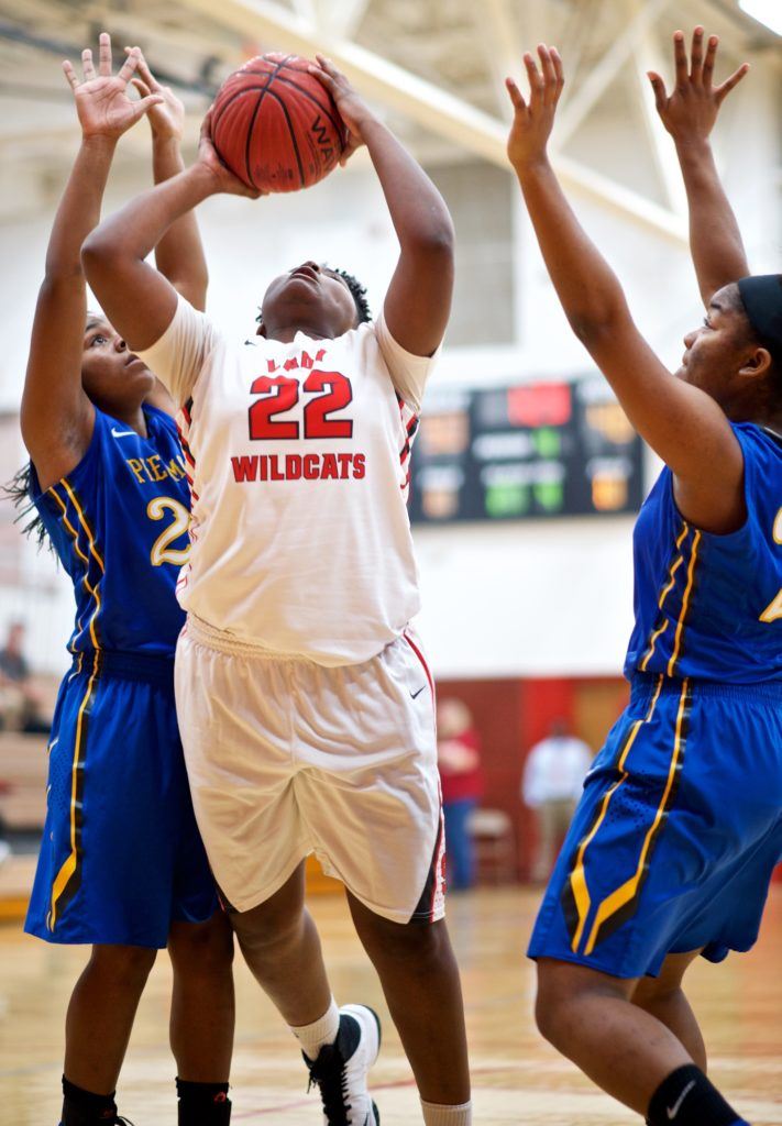 Saks' TeeTee Jenkins (22) splits the Piedmont defense to get to the basket. (Photo by B.J. Franklin/GungHo Photos)