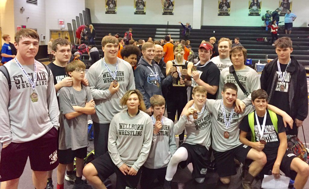 The Wellborn wrestling team poses with their medals after winning the Golden Bear Classic. You'll notice St. Clair County heavyweight Skyler Mizzell to the far right; he was asked to join the photo after his pin clinched the title for the Panthers. (Photo by Chris Hayes). 