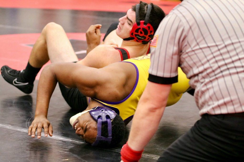 Weaver's Kyle Clapper (L) keeps the pressure on Tallassee's Kiwanis Woods in their 170 title match. (Photo by Daniel Lee)