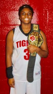 Cleburne County's Shawntavia Boyd proudly displays the 'Charge Belt' that recognizes a Lady Tigers ability to take a charge.  