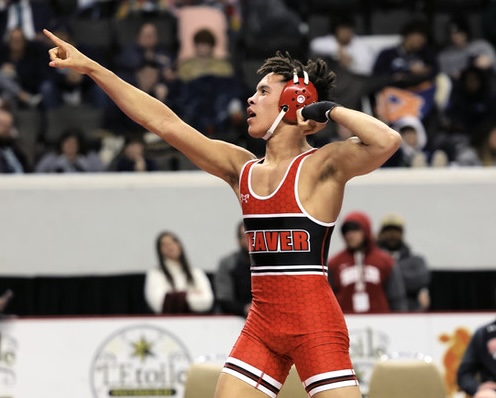 Weaver’s J.D. Johannson flexes after winning the 160 state title to get the Bearcats closer to the team title. (Photo by Jimmy Smith)
