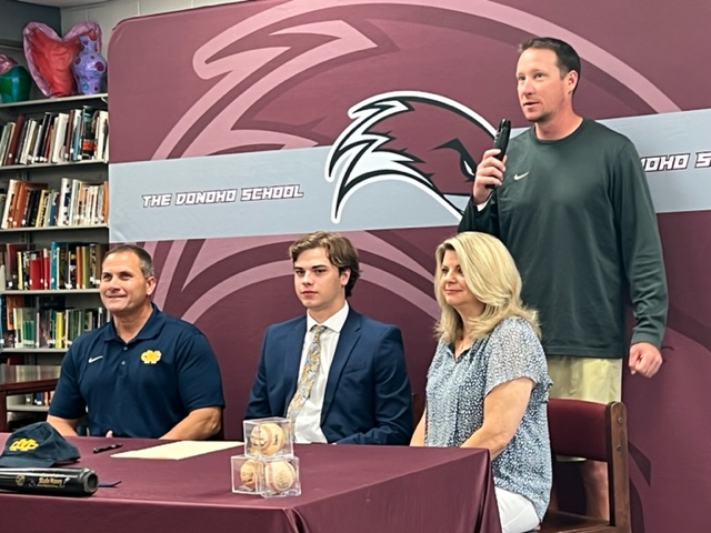 Donoho baseball coach Steve Gendron says a few words about Slade Haney (C) before the Falcons senior signs to play at Mississippi College. (Cover photo by B.J. Franklin)