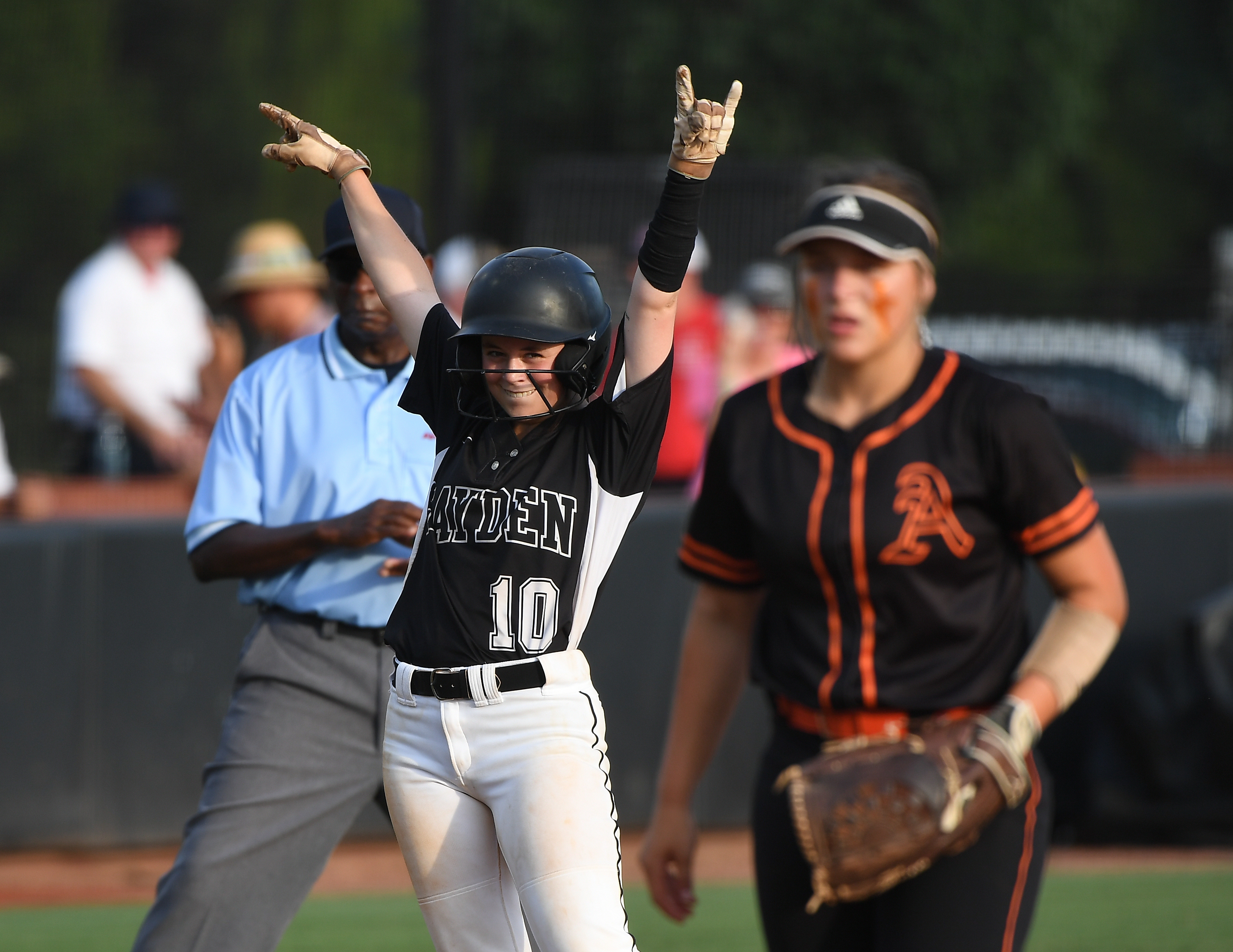 Hayden’s Alyssa Jinright celebrates her arrival at third with a sixth-inning triple that led to the go-ahead run in the Lady Wildcats’ Game 1 victory. (Photo by B.J. Franklin)
