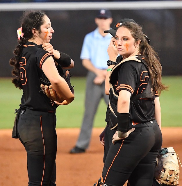 The frustration of the night is etched on the faces of Alexandria sisters pitcher Rylee (L) and catcher Chloe Gattis. (Photo by B.J. Franklin)