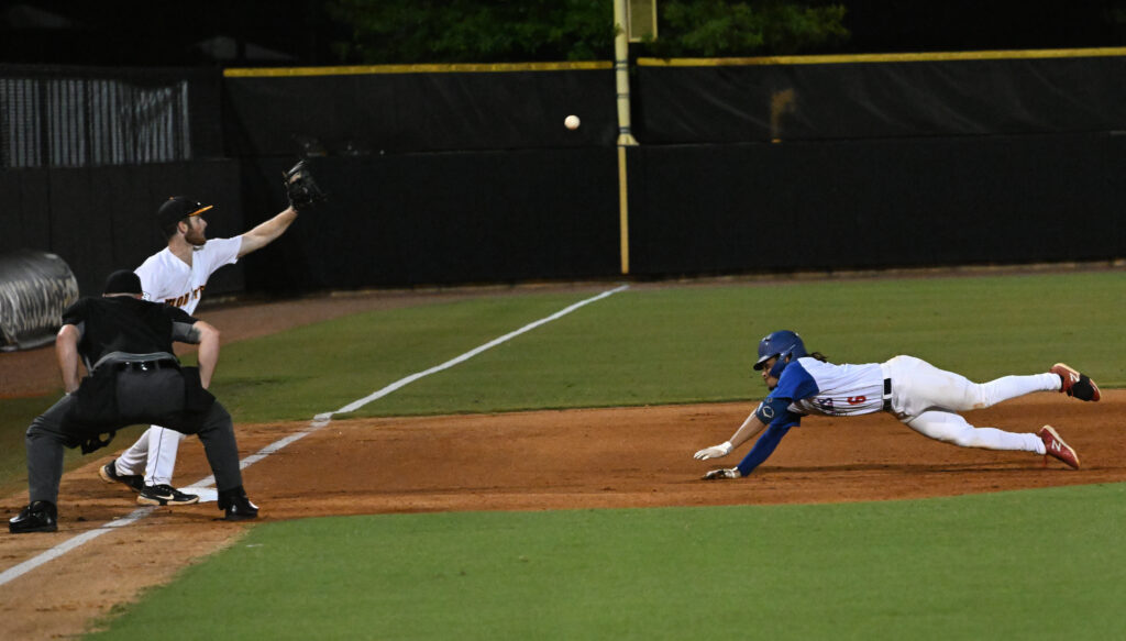 Monsters third baseman Dom Scavone sets up to catch J.J. Rapp’s relay and put the tag on Allen Grier to keep the Atlanta Blues’ hitter from stretching his RBI double into a triple in the third inning. (Photo by B.J. Franklin)