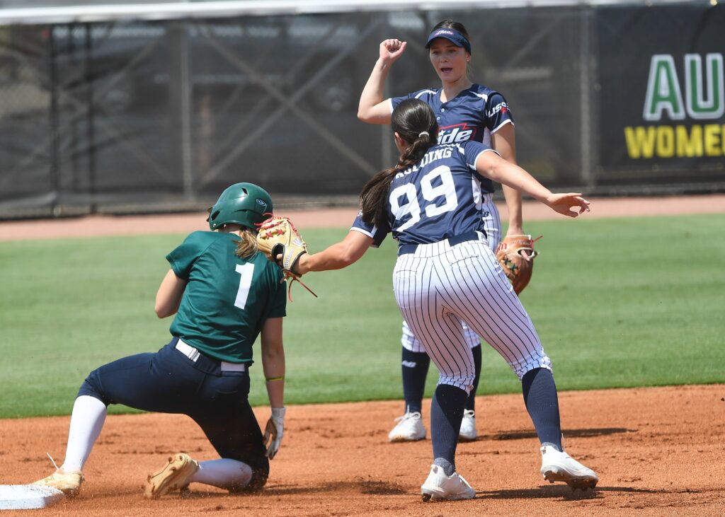 The USSSA Pride is looking for a favorable call when Delaney Spaulding (99) puts the tag on Australia’s Jade Wall during the team’s afternoon exhibition game Tuesday at Choccolocco Park. Japan (cover) beat the U.S. National Team in the day’s final game. (Photos by B.J. Franklin/GungHo Photos)