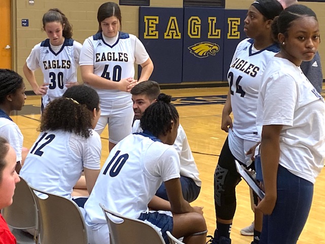 Jacksonville’s Tres Buzan gives his girls basketball team instruction during a time out. Buzan was named the Golden Eagles’ boys basketball coach Tuesday.