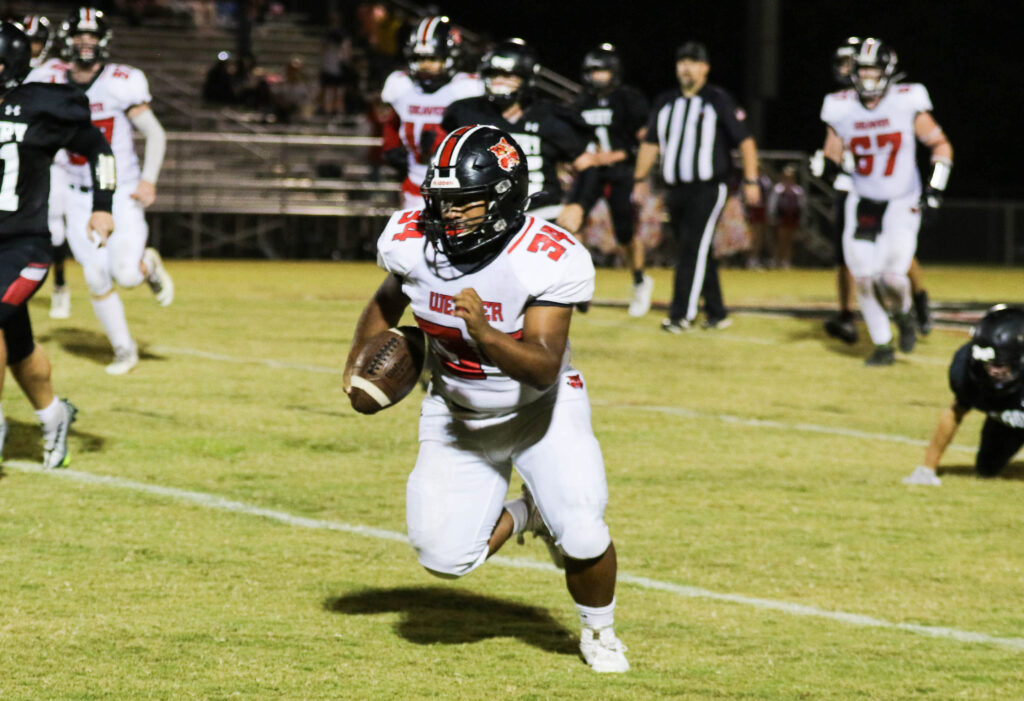 Weaver’s Payton Martin runs for his second touchdown of the game against Asbury. (Photo by Greg Warren)