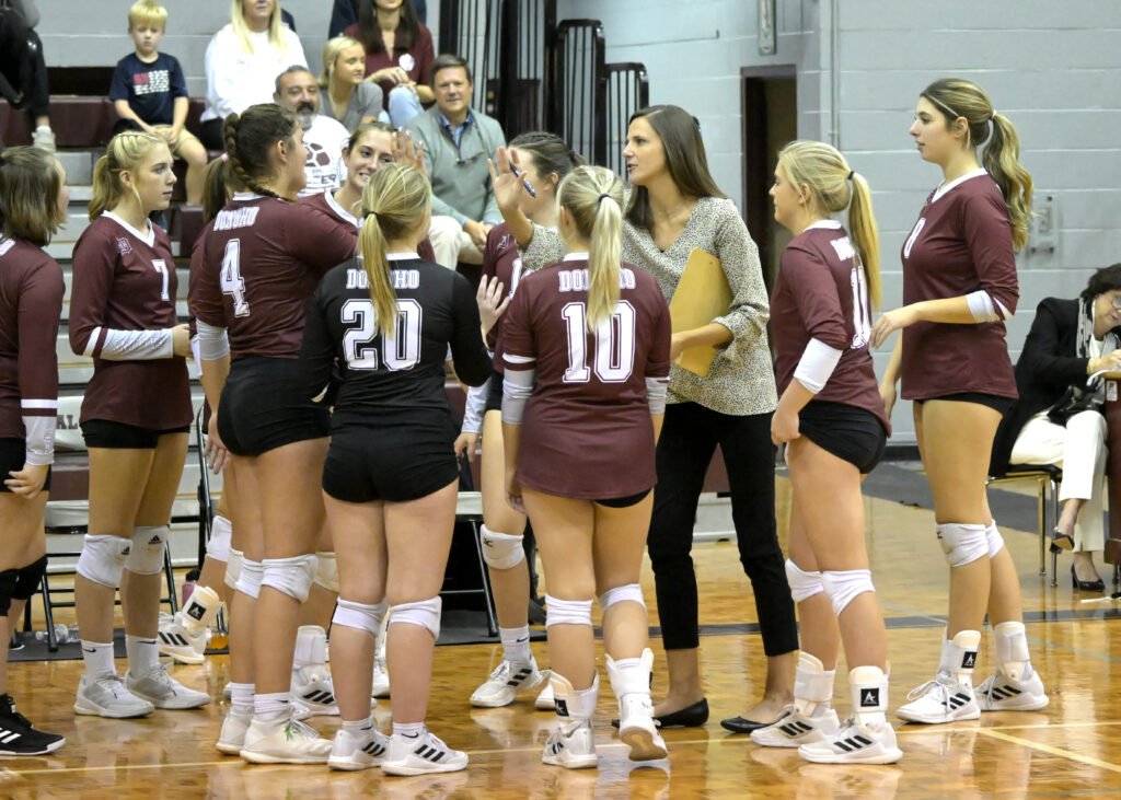 First-year Donoho coach Anna Taylor encourages her team during its match with Pleasant Valley. (Photo by B.J. Franklin)