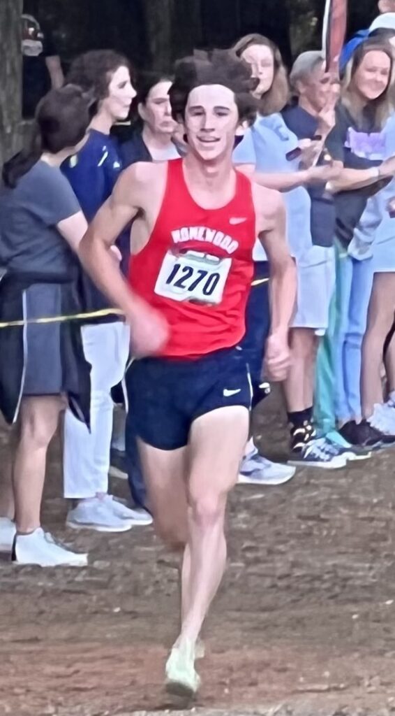 Homewood’s Andrew Laird heads to the finish for his first varsity win.