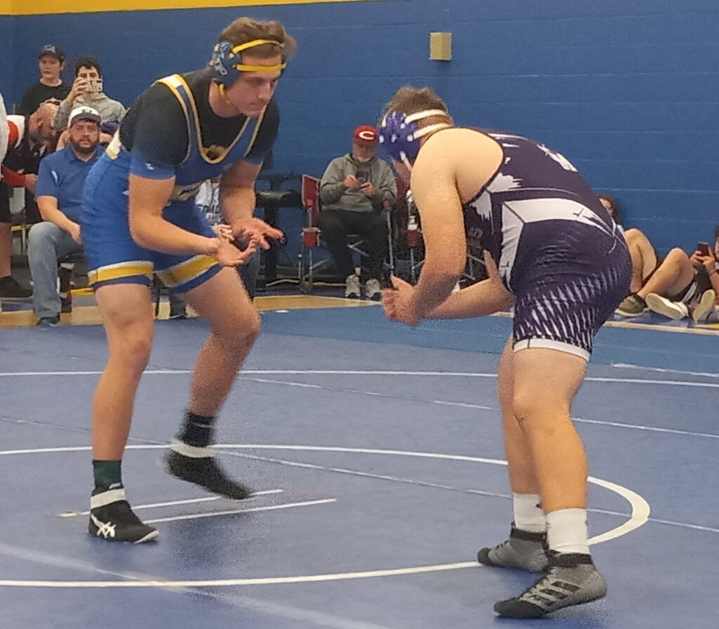 Piedmont’s ChrisJon Gurley goes to work against Susan Moore’s Anthony Flores during their 222-pound title match in Saturday’s Piedmont Dogfight. Gurley won a 3-2 decision. (Photo by Joe Medley)