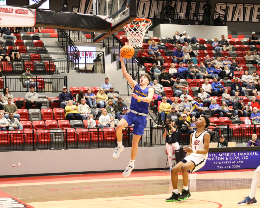 Piedmont’s Rollie Pinto goes up for two points during the Bulldogs’ victory over Anniston in Wednesday’s Calhoun County quarterfinals in Pete Mathews Coliseum. (Photo by Greg Warren)