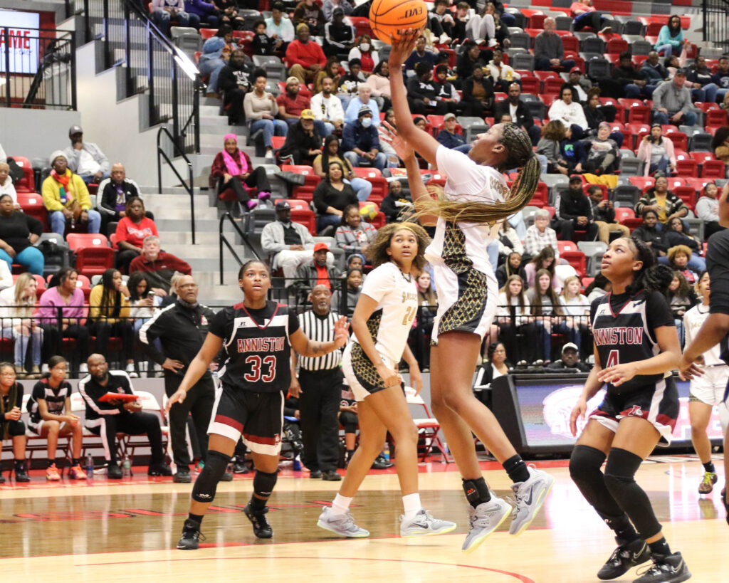 Oxford’s Mya McGrue goes in for a layup against Anniston in Friday night’s Calhoun County girls tournament championship game. McGrue, known as a defensive specialist, was the Yellow Jackets’ leading scorer with 17 points. (Photo by Greg Warren)