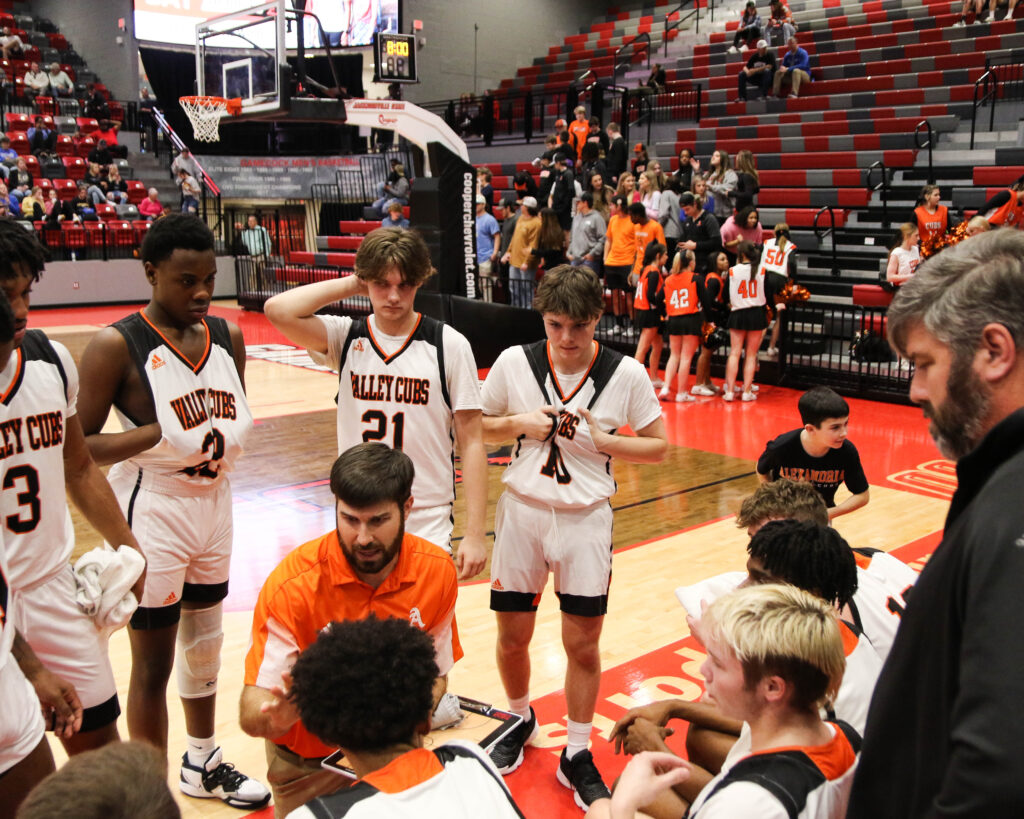 Alexandria coach Will Ginn talks during a timeout in the Valley Cubs’ quarterfinal against White Plains on Wednesday in Pete Mathews Coliseum. (Photo by Greg Warren)