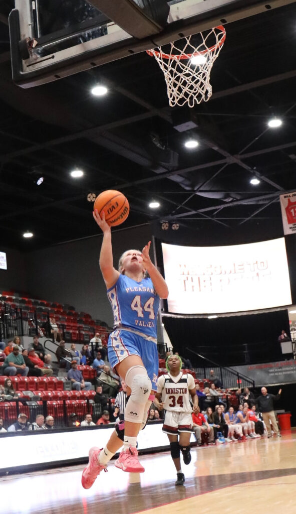 Pleasant Valley’s Macey Roper goes up for two of her 17 points during Tuesday’s Calhoun County quarterfinal against Anniston (Photo by Krista Larkin)