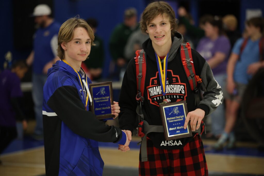 White Plains’ Tanner Jarrell and Saks’ Trent Hopkins participated in the Piedmont Dogfight match of the day, as voted by coaches. Hopkins won their 115-pound final in a 9-4 decision. Hopkins picked up his 100th victory earlier in the day. (Photo by Phillip Hopkins)